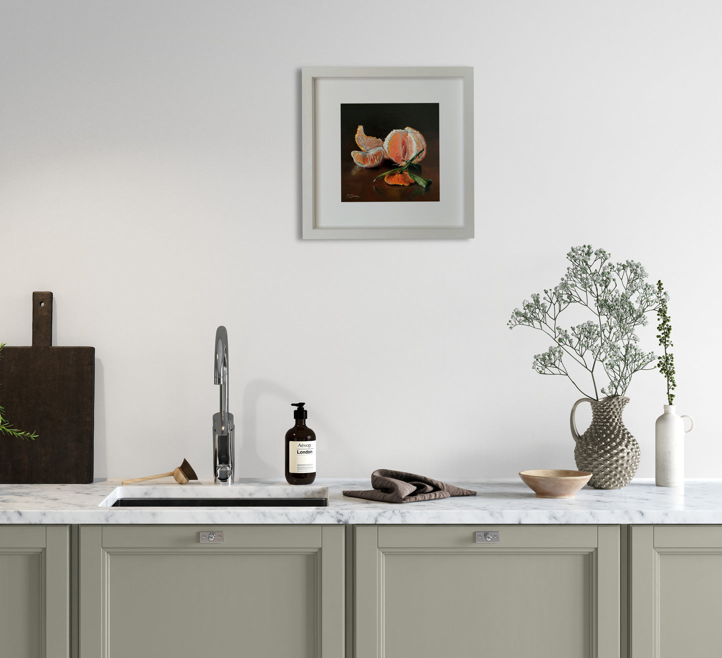A painting of a mandarin hanging on the kitchen wall