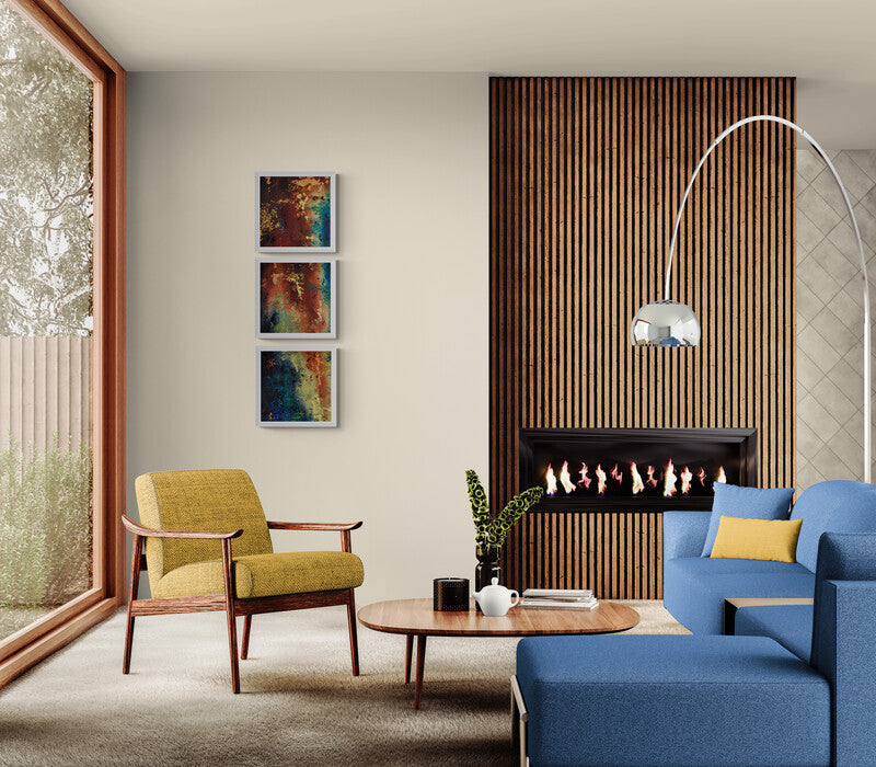 abstract art on a modern living room with a blue sofa