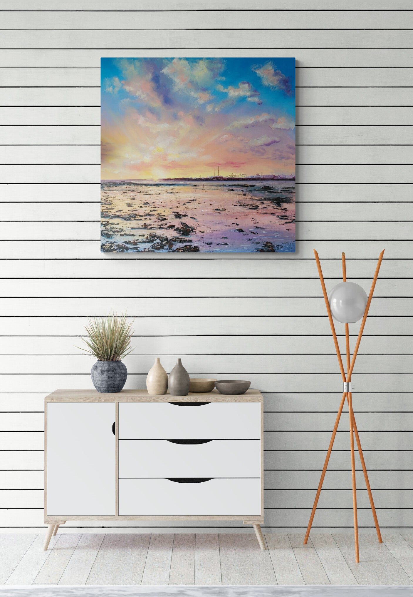 Oil painting depicting a beautiful sunset at Clontarf reflected on the water in blue. pink, purple and yellow