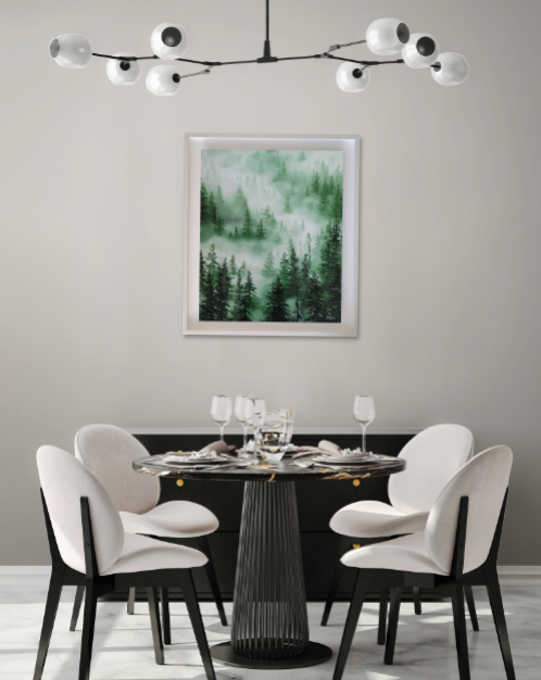 Kitchen table with a painting of a misty forest in greens on the wall
