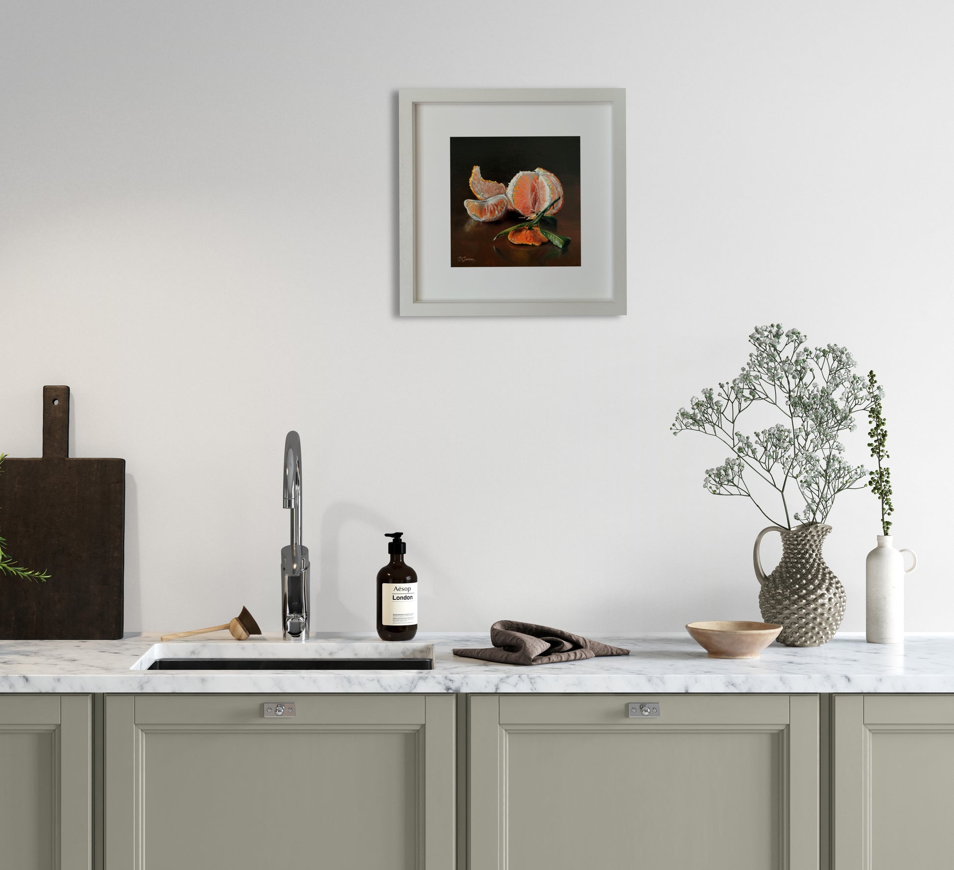 A painting of a mandarin hanging on the kitchen wall