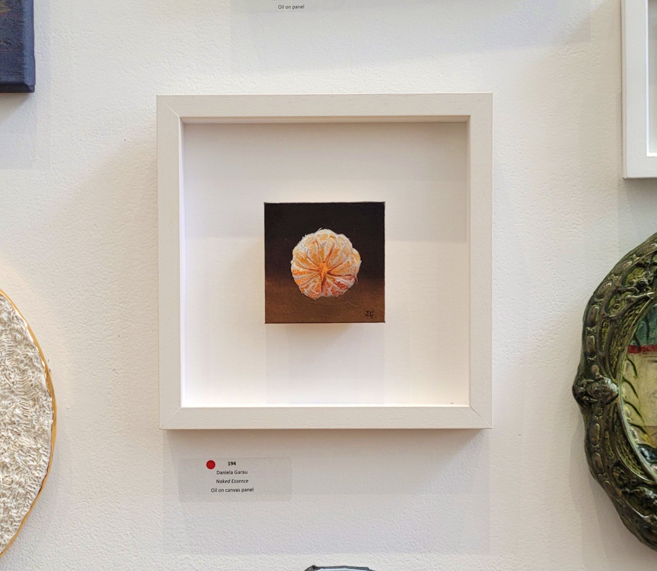 Framed orange painting by Daniela Garau on the wall of the 195th RHA Exhibition in Dublin