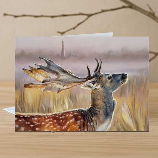 Greeting card with a deer illustration at Phoenix Park on a wooden surface