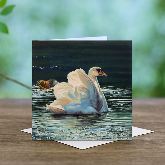 A card depicting a swan swimming quietly on the water